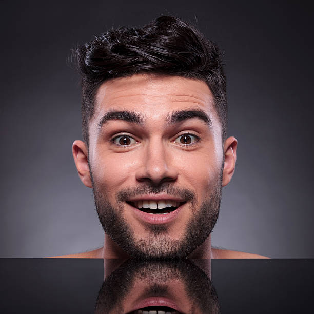 istock head of young man smiling at you 492794645