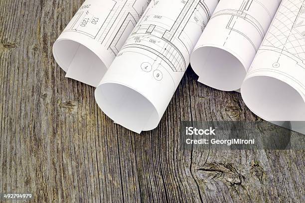 Project Drawings On The Background Of Wooden Boards Stock Photo - Download Image Now