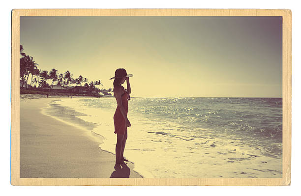 Retro Old Antique Postcard of the Beach Paradise of Hawaii A Retro 40s-50s style antique postcard with a young woman on a tropical beach. kauai photos stock pictures, royalty-free photos & images