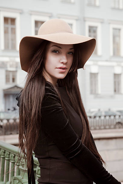 istock Elegant young woman in hat 492795439