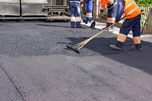 Repair of roads Workers on Asphalting paver machine during Road street repairing works compactor photos stock pictures, royalty-free photos & images