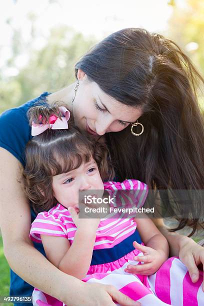 Loving Mother Consoles Crying Baby Daughter Stock Photo - Download Image Now - Brat, Child, Outdoors