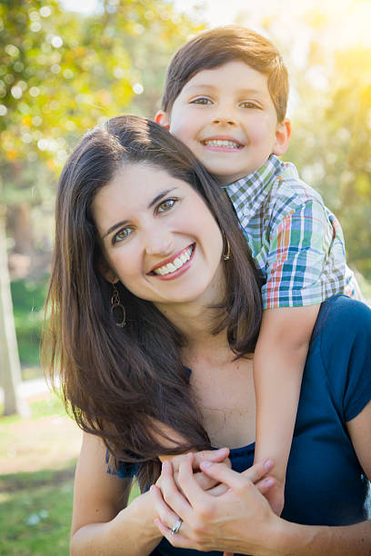 istock Attractive Mixed Race Mother and Son Hug in Park 492796143