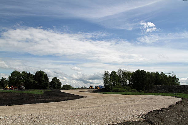 istock Road Construction and Energy power line 492796887