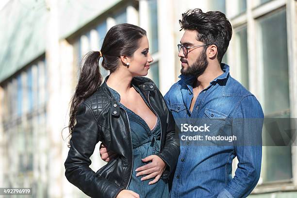 Young Man And Woman Look At Each Other Stock Photo - Download Image Now - Adult, Beard, Beautiful People