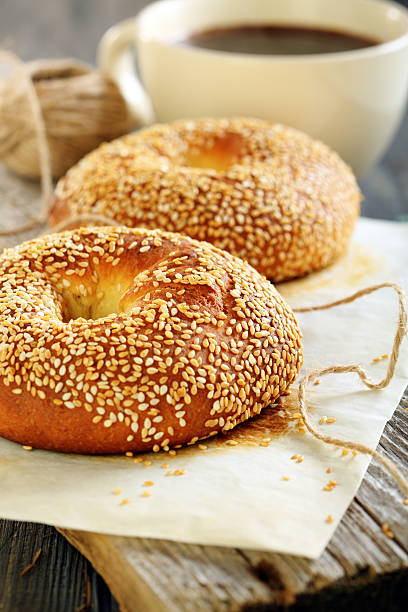 istock Breakfast. Sweet bagels with sesame seeds and coffee. 492797349