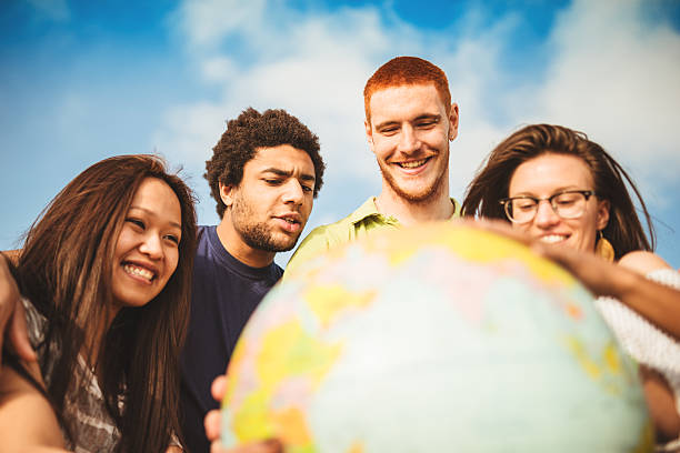istock teenagers college student smiling with globe 492798371