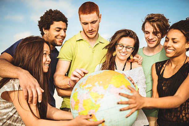 istock teenagers college student smiling with globe 492798373