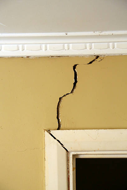Building problems Cracks appearing in an interior wall. stability stock pictures, royalty-free photos & images