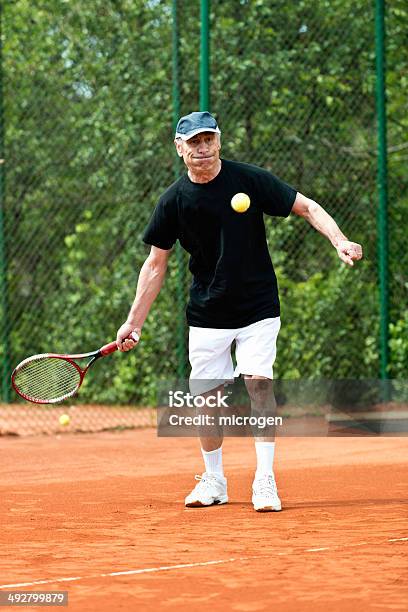 Active Senior Man Playing Tennis Stock Photo - Download Image Now - 70-79 Years, Active Lifestyle, Active Seniors