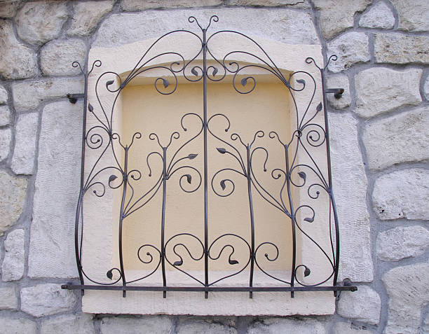 istock Decorative wrought iron grille on walled window 492802750