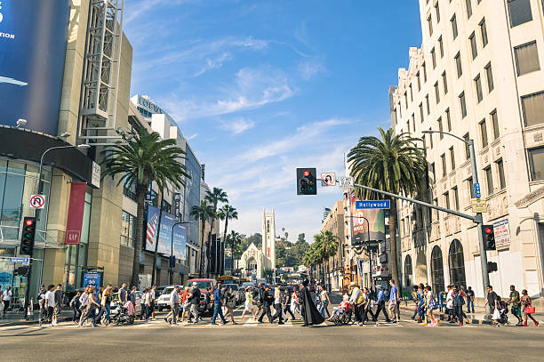Hollywood Boulevard and Walk of Fame in Los Angeles Los Angeles, United States - March 21, 2015: crowded street with multiracial people walking on Hollywood Boulevard the world famous Walk of Fame created in 1958 as a tribute to artists working in the movie industry. los angeles traffic jam stock pictures, royalty-free photos & images