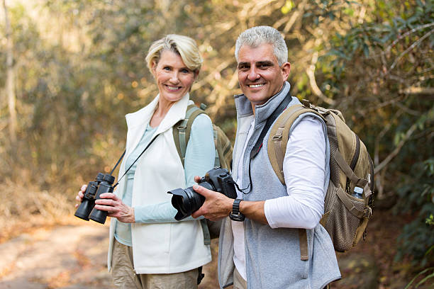 istock mature couple in forest looking at the camera 492806546