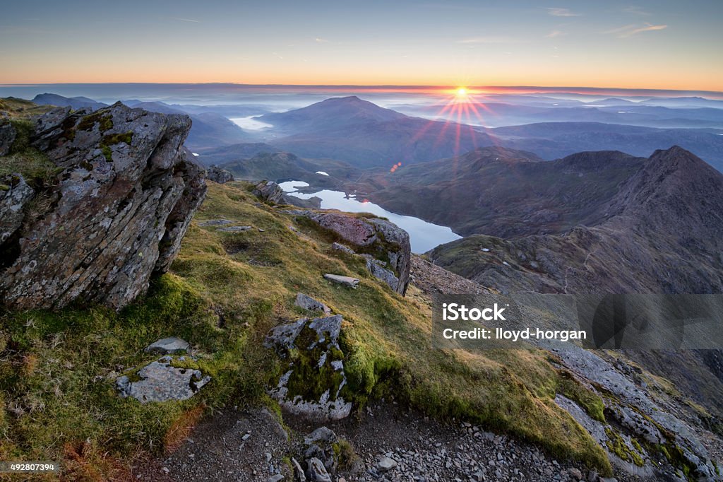Snowdonia National Park An amazing sunrise over the Snowdonia national park as view from the summit of Snowdon on a cold Octobers morning.  Mount Snowdon Stock Photo