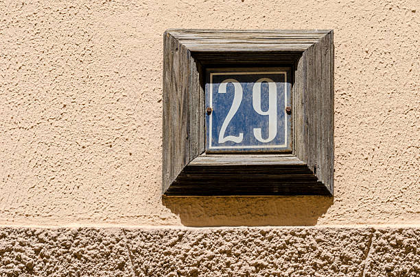 House number twenty nine on a wall.