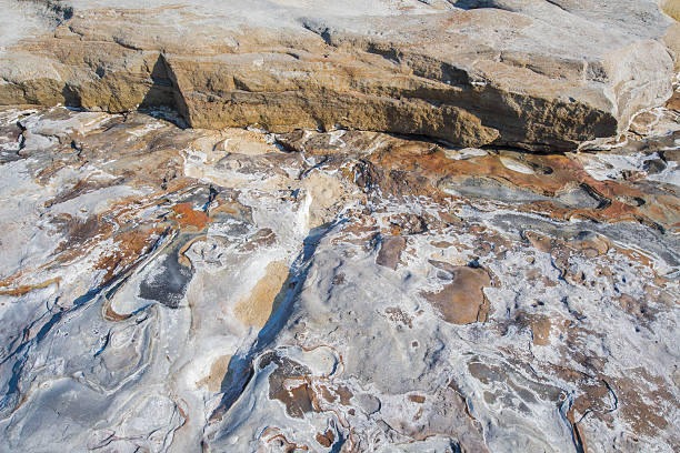 istock Huge sedimentary rocks by the ocean 492808330