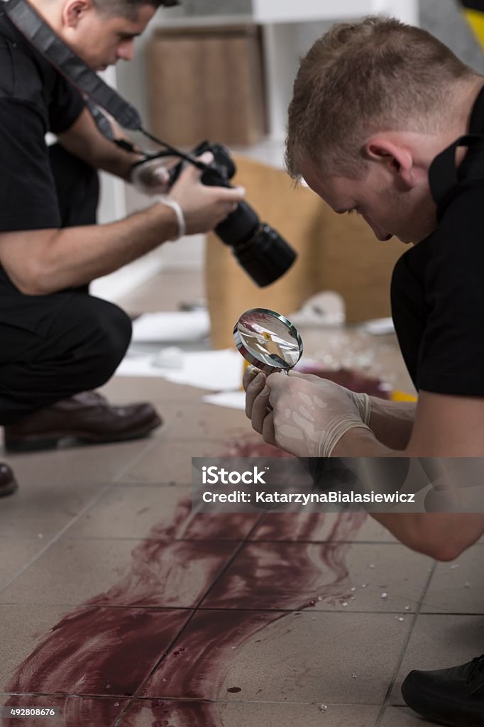 Police at the murder scene Police officers working at the murder scene 2015 Stock Photo