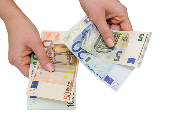 istock eupo banknotes in female hand, isolated 492809180
