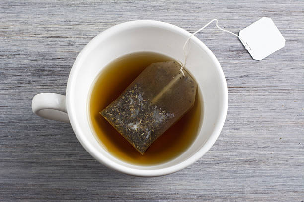 istock Cup of Healthy Tea over wood background 492810156
