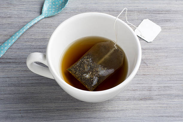 istock Cup of Healthy Tea over wood background 492810630
