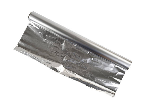 istock New roll of aluminum foil on a white background. 492813528