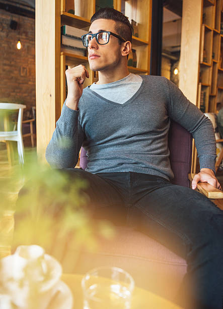 istock Handsome young man in casual clothes having coffee break 492813544