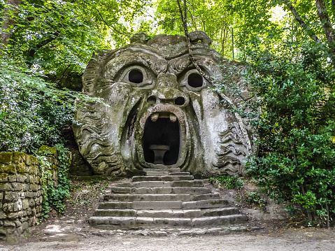Orcus mouth sculpture at famous Parco dei Mostri (Park of the Monsters), also named Sacro Bosco (Sacred Grove) or Gardens of Bomarzo in Bomarzo, province of Viterbo, northern Lazio, Italy