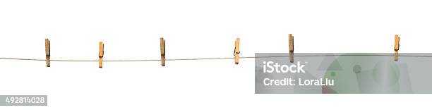 Old Wooden Clothespins On A Rope Isolated Stock Photo - Download Image Now - Clothesline, Cut Out, String