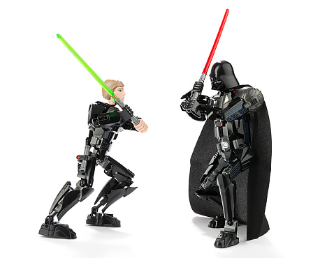 Ankara, Turkey - October 13, 2015:  New Lego Star Wars Darth Vader and Luke Skywalker are fighting with sword isolated on white background. 