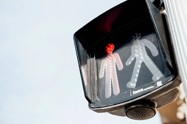 Red traffic light for pedestrians on clear white background