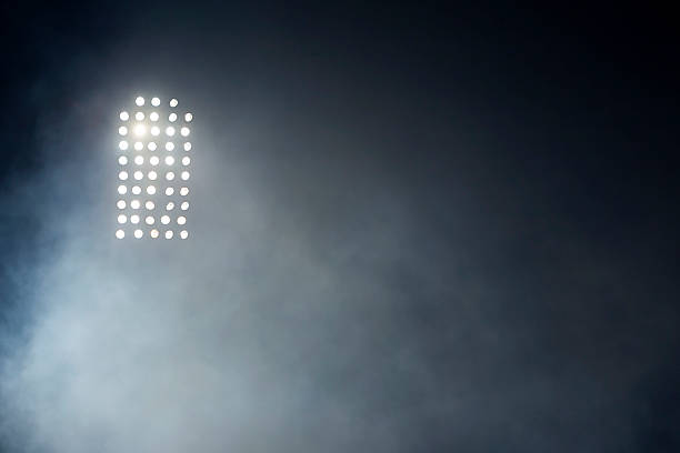istock Stadium lights against dark night sky backgroundon 492814895