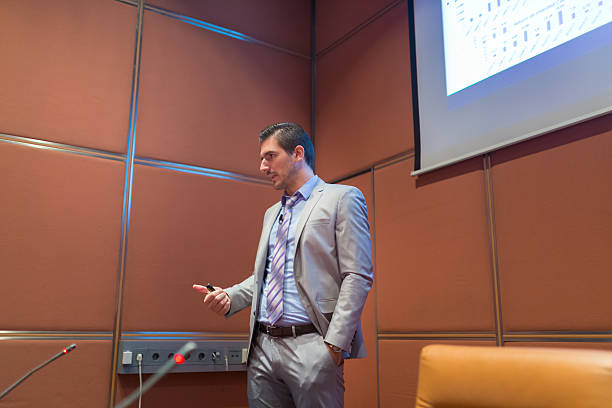 istock Speaker giving talk at Business Conference. 492814946
