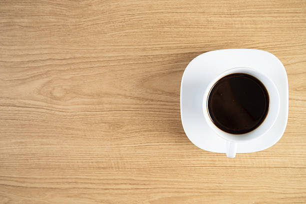 istock Fresh Black Coffee on a Wooden Table 492815036