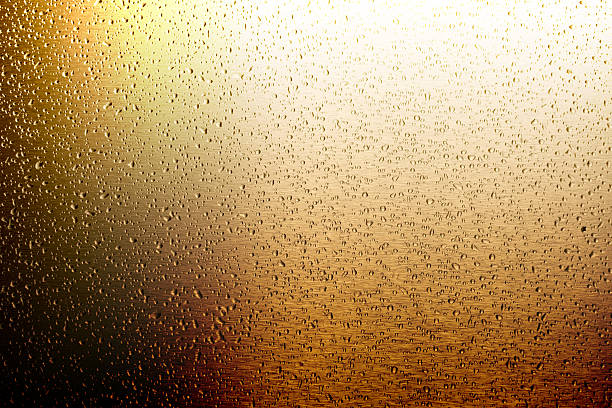 istock water drop on gold metal surface 492815124