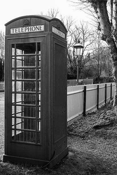 istock Old fashioned Red English phone box in B&W 492815807