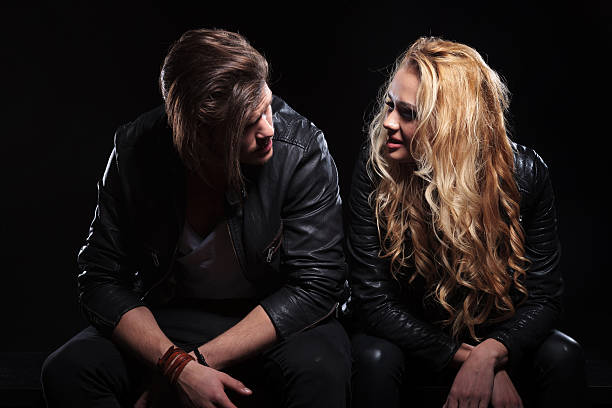 istock seated couple looking at each other 492815865
