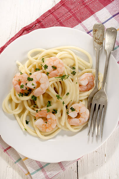 istock macaroni with cheese sauce and prawns 492816273