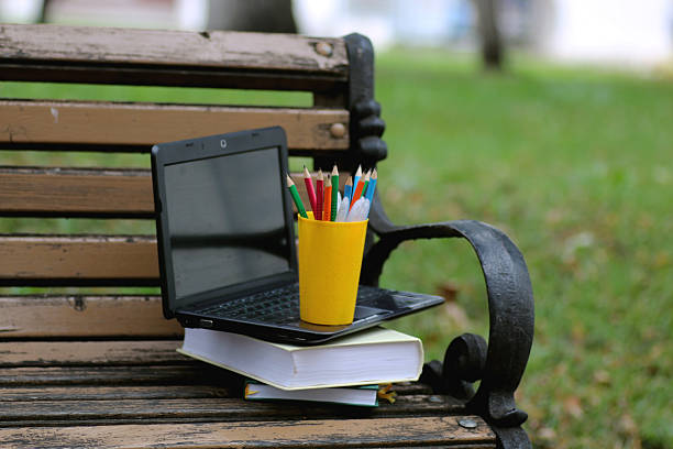istock books on a bench in the school year 492817422