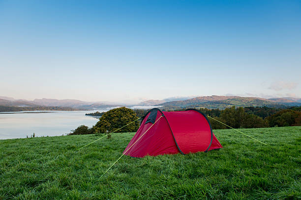 istock red Tent on a hill overlooking a lake 492817534