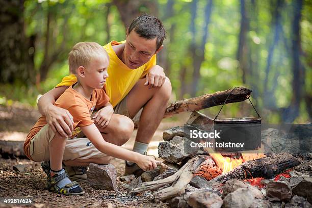 Father With Son At Camping Stock Photo - Download Image Now - 2015, 6-7 Years, Boys