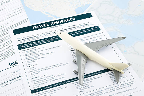 istock Travel insurance form and   plane model 492819313