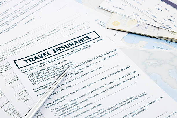 istock Travel insurance form, passport and tickets on world map paperwork 492819333