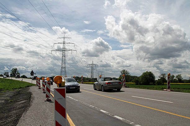 istock Road Construction and Energy power line 492819865