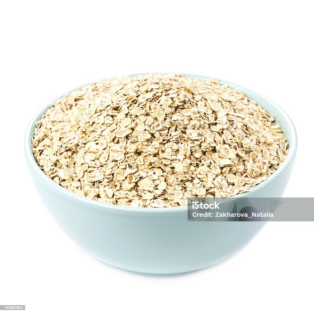 Oat flakes for Breakfast isolated  on white background. Healthy Oat flakes for Breakfast isolated  on white background. Healthy Homemade Oatmeal breakfast in a bowl close up. Bowl Stock Photo