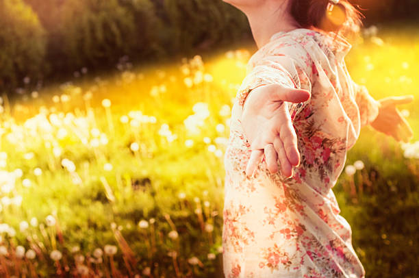 istock Young woman relaxing in a meadow 492822051