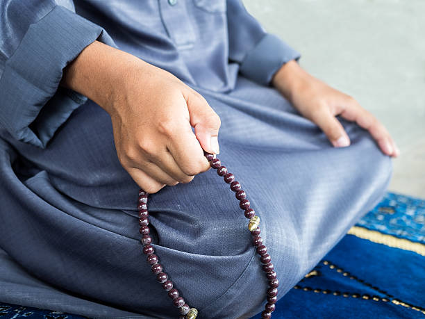 istock muslim child praying for Allah 492839692