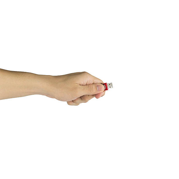 istock Flash drive in man hand isolated on white background 492840328