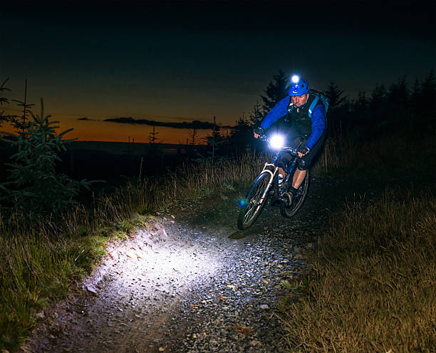istock Night-ride mountiain biking with lights 492842346