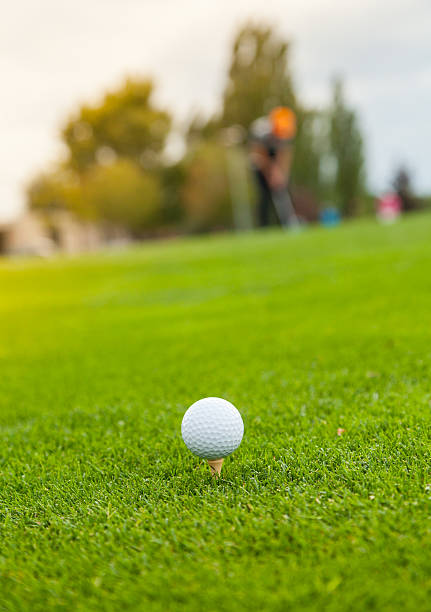 istock Golf ball on the green lawn 492842532