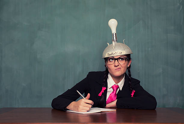 istock Retro Businesswoman with Thinking Cap is Confused 492846040